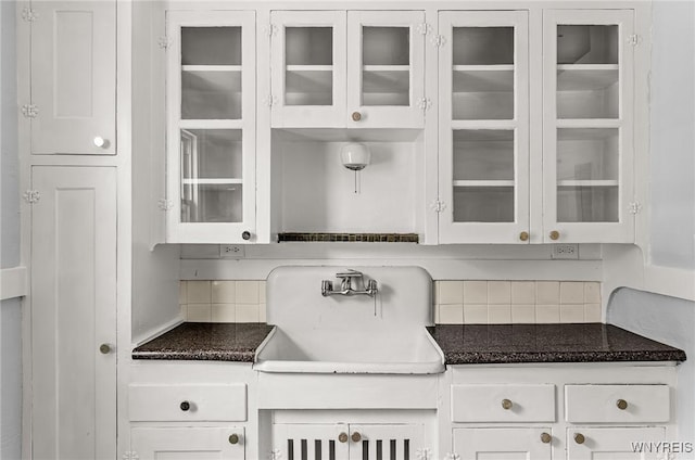 374 Victoria Blvd, Tonawanda-Town, NY 14217 - kitchen featuring tasteful backsplash, a sink, glass insert cabinets, and white cabinetry