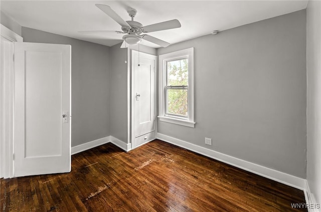 374 Victoria Blvd, Tonawanda-Town, NY 14217 - unfurnished bedroom with baseboards, dark wood-style flooring, and ceiling fan