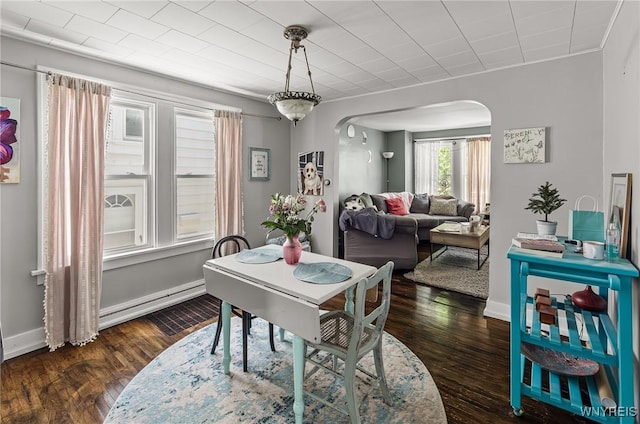 374 Victoria Blvd, Tonawanda-Town, NY 14217 - dining room with arched walkways, wood finished floors, and baseboards