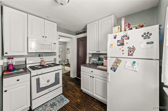 374 Victoria Blvd, Tonawanda-Town, NY 14217 - kitchen with white appliances, white cabinets, dark countertops, and dark wood-style floors