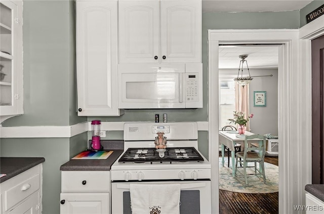 374 Victoria Blvd, Tonawanda-Town, NY 14217 - kitchen featuring white appliances, dark countertops, and white cabinetry