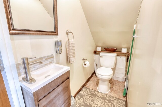 26 Pine Tree Village Rd Unit 26, Ellicottville, NY 14731 - bathroom with vanity, toilet, and baseboards