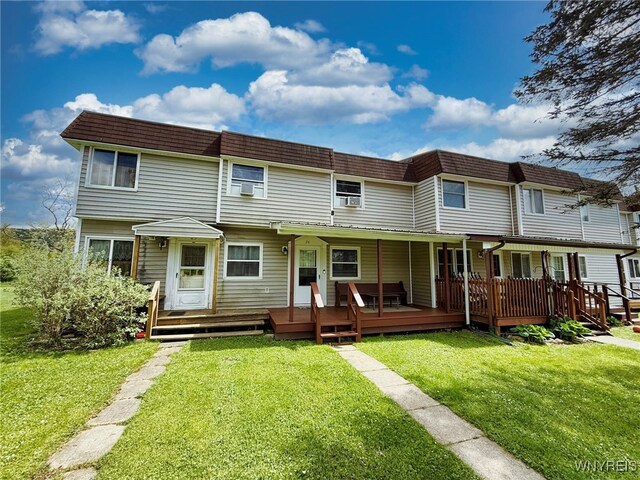 26 Pine Tree Village Rd Unit 26, Ellicottville, NY 14731 - back of house with mansard roof, a lawn, and a deck