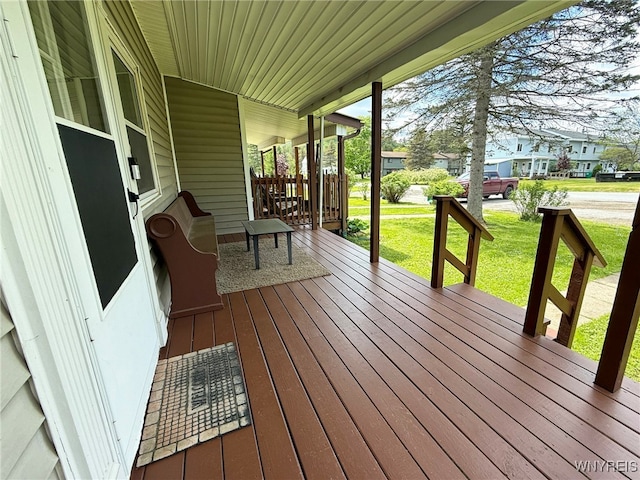 26 Pine Tree Village Rd Unit 26, Ellicottville, NY 14731 - wooden porch with a lawn and a residential view