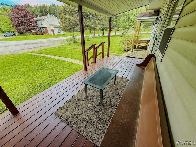 26 Pine Tree Village Rd Unit 26, Ellicottville, NY 14731 - porch featuring a lawn