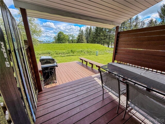 26 Pine Tree Village Rd Unit 26, Ellicottville, NY 14731 - wooden deck with area for grilling and a lawn
