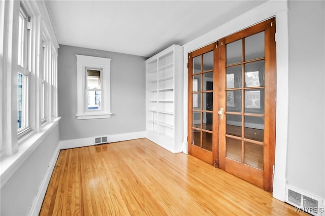 75 N Park Ave, Buffalo, NY 14216 - unfurnished room with wood finished floors, baseboards, and french doors