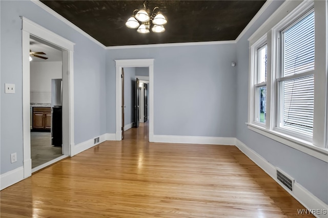 75 N Park Ave, Buffalo, NY 14216 - unfurnished dining area featuring light wood finished floors, a chandelier, baseboards, ornamental molding, and a ceiling fan