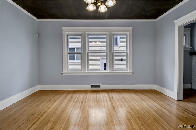 75 N Park Ave, Buffalo, NY 14216 - unfurnished room featuring baseboards, wood finished floors, crown molding, and a chandelier