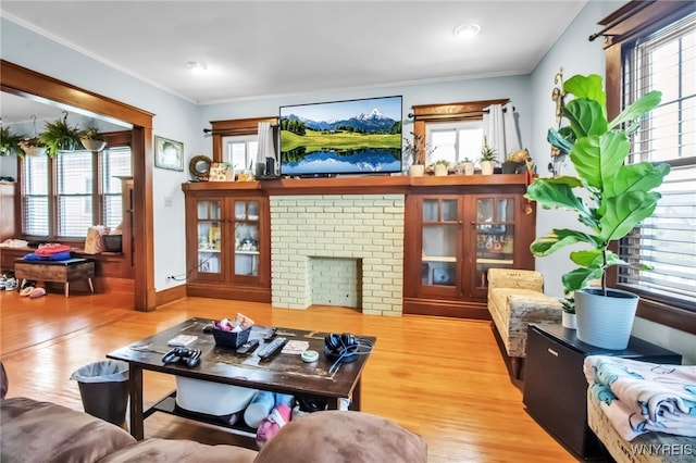 75 N Park Ave, Buffalo, NY 14216 - living room with healthy amount of natural light, wood finished floors, crown molding, and a fireplace