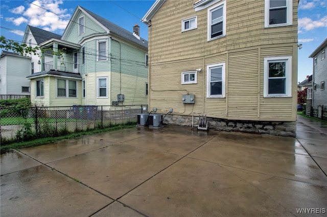 75 N Park Ave, Buffalo, NY 14216 - rear view of house with central air condition unit and a patio