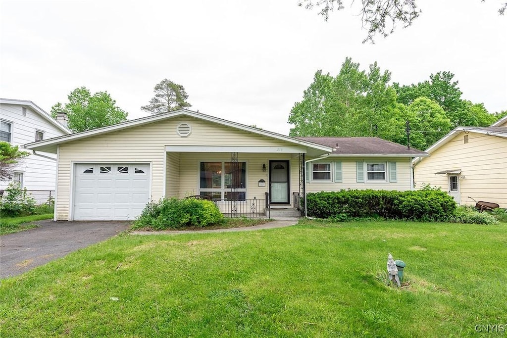 219 Longmeadow Dr, Syracuse, NY 13205 - ranch-style home featuring covered porch, asphalt driveway, a garage, and a front lawn