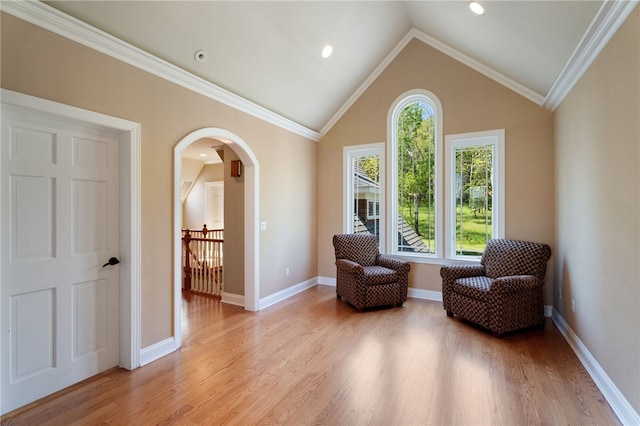 436 Steuben St, Reading, NY 14891 - living area with arched walkways, light wood-type flooring, lofted ceiling, baseboards, and crown molding
