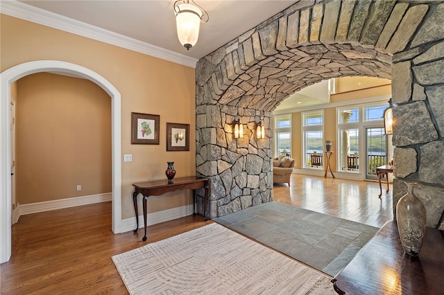 436 Steuben St, Reading, NY 14891 - foyer entrance featuring arched walkways, baseboards, ornamental molding, and wood finished floors