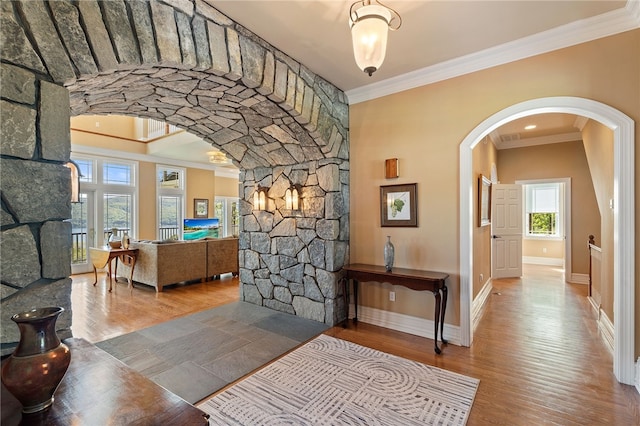 436 Steuben St, Reading, NY 14891 - corridor with crown molding, arched walkways, wood finished floors, and baseboards