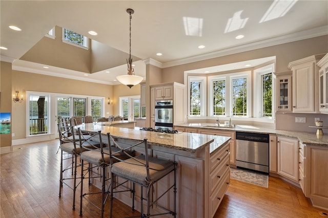 436 Steuben St, Reading, NY 14891 - kitchen with dishwasher, a sink, a kitchen breakfast bar, a large island with sink, and light wood-style floors