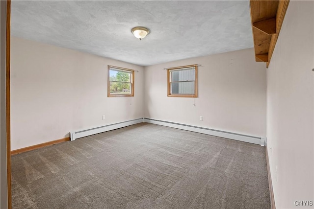 3583 W Seneca Tpke, Onondaga, NY 13215 - carpeted spare room with baseboards, a textured ceiling, and a baseboard heating unit