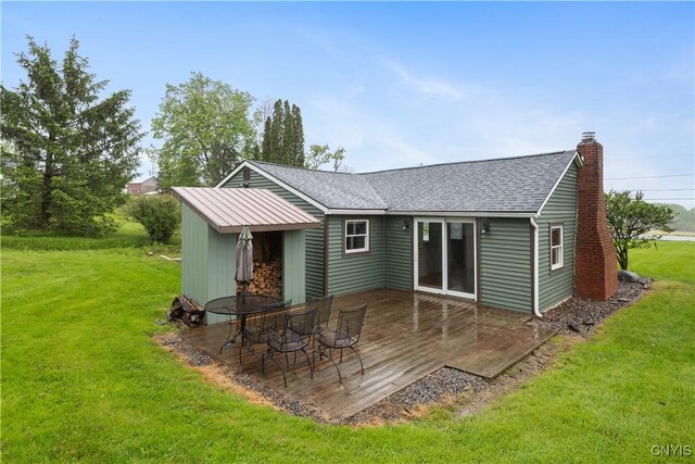 3583 W Seneca Tpke, Onondaga, NY 13215 - back of property with a deck, a yard, a chimney, and roof with shingles