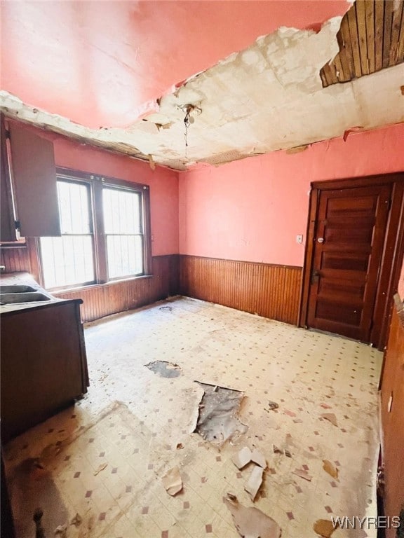 497-499 Riley St, Buffalo, NY 14208 - unfurnished room featuring wainscoting and wooden walls