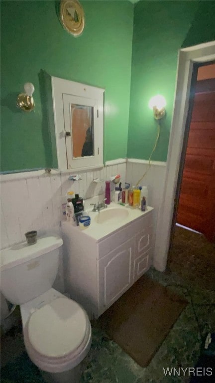 497-499 Riley St, Buffalo, NY 14208 - bathroom featuring a wainscoted wall, vanity, toilet, and tile walls