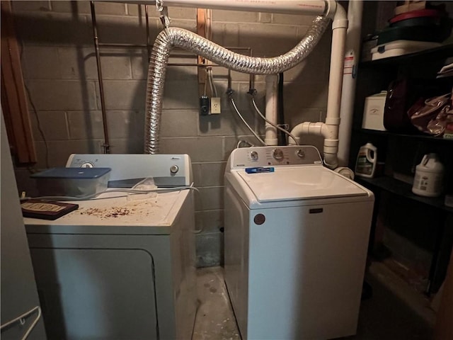 441 Center St, Geddes, NY 13209 - laundry room featuring concrete block wall and washer and clothes dryer