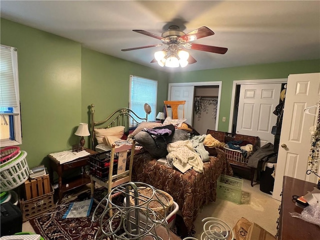 441 Center St, Geddes, NY 13209 - bedroom featuring a ceiling fan, carpet flooring, and multiple closets
