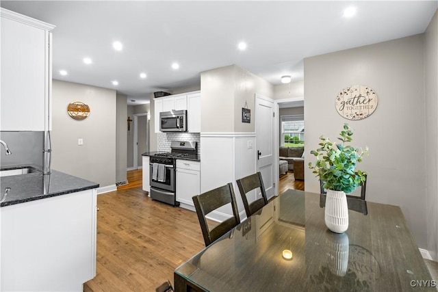 915 W Thomas St, Rome-Inside, NY 13440 - dining room featuring light wood-style floors, recessed lighting, and baseboards