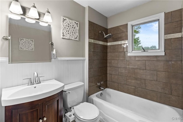 915 W Thomas St, Rome-Inside, NY 13440 - full bathroom featuring a wainscoted wall, toilet, vanity, and tub / shower combination