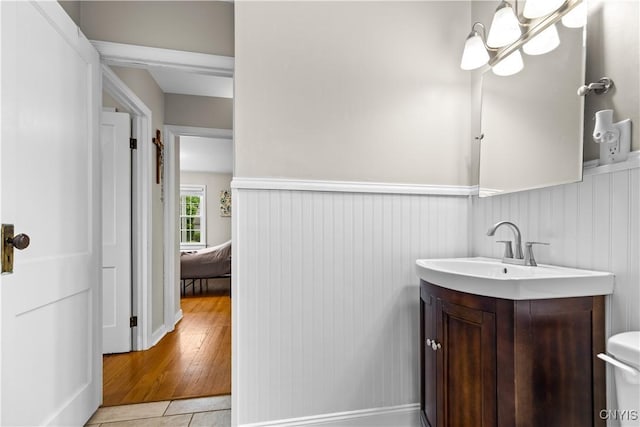 915 W Thomas St, Rome-Inside, NY 13440 - half bath featuring vanity, a wainscoted wall, toilet, and tile patterned floors