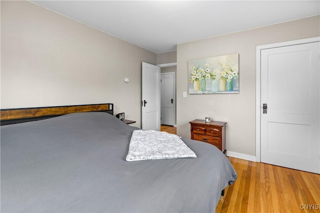 915 W Thomas St, Rome-Inside, NY 13440 - bedroom with light wood-style flooring and baseboards