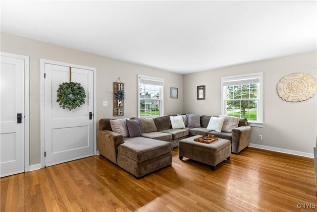 915 W Thomas St, Rome-Inside, NY 13440 - living room featuring light wood finished floors and baseboards