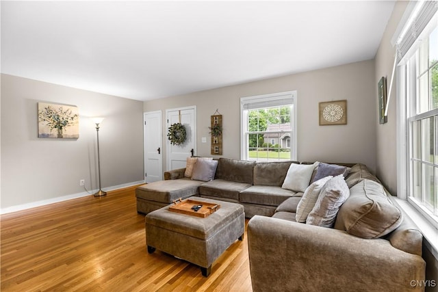 915 W Thomas St, Rome-Inside, NY 13440 - living room with light wood-style floors and baseboards