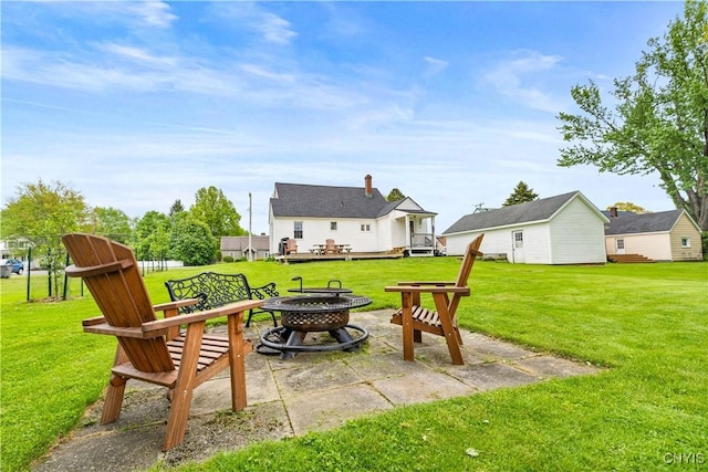 915 W Thomas St, Rome-Inside, NY 13440 - view of grassy yard featuring a fire pit, a deck, and a patio area