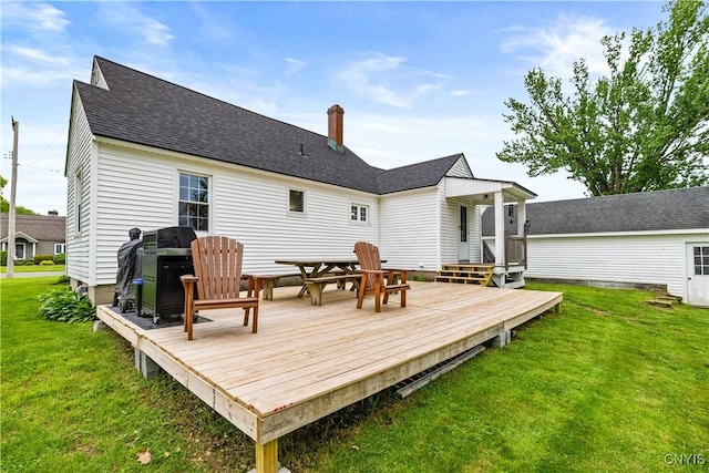 915 W Thomas St, Rome-Inside, NY 13440 - back of house featuring a lawn, a chimney, a deck, and a shingled roof