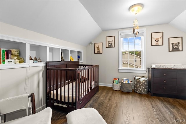 915 W Thomas St, Rome-Inside, NY 13440 - bedroom with vaulted ceiling, wood finished floors, a crib, and baseboards