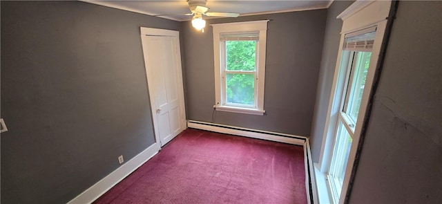 104 Main St, Stamford, NY 12167 - spare room featuring a baseboard heating unit, dark colored carpet, a ceiling fan, and baseboards