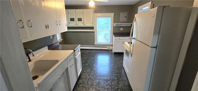 104 Main St, Stamford, NY 12167 - kitchen with freestanding refrigerator, baseboard heating, white cabinetry, a sink, and ceiling fan