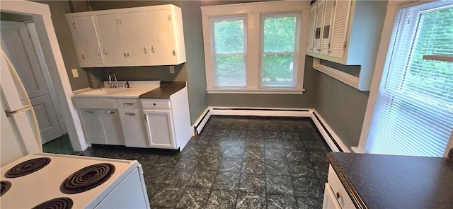 104 Main St, Stamford, NY 12167 - kitchen featuring white electric stove, plenty of natural light, white cabinets, and a sink