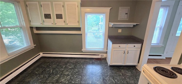 104 Main St, Stamford, NY 12167 - kitchen featuring a baseboard radiator, plenty of natural light, white cabinetry, and baseboards