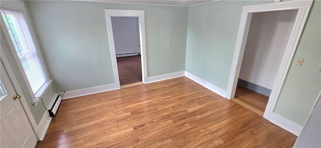 104 Main St, Stamford, NY 12167 - unfurnished room featuring a baseboard heating unit, baseboards, and plenty of natural light