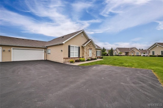 5692 Ferncrest Ct Unit B, Clarence, NY 14032 - ranch-style house featuring asphalt driveway, a front lawn, a garage, and a residential view