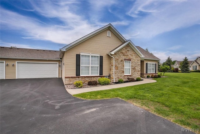 5692 Ferncrest Ct Unit B, Clarence, NY 14032 - view of front of home featuring stone siding, driveway, a front lawn, and a shingled roof