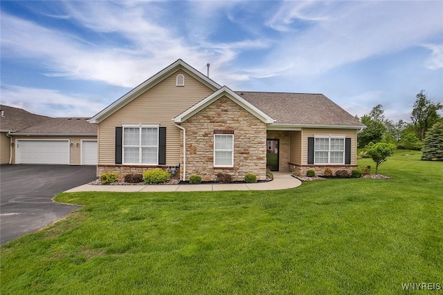 5692 Ferncrest Ct Unit B, Clarence, NY 14032 - view of front facade with stone siding, asphalt driveway, a front yard, a garage, and roof with shingles