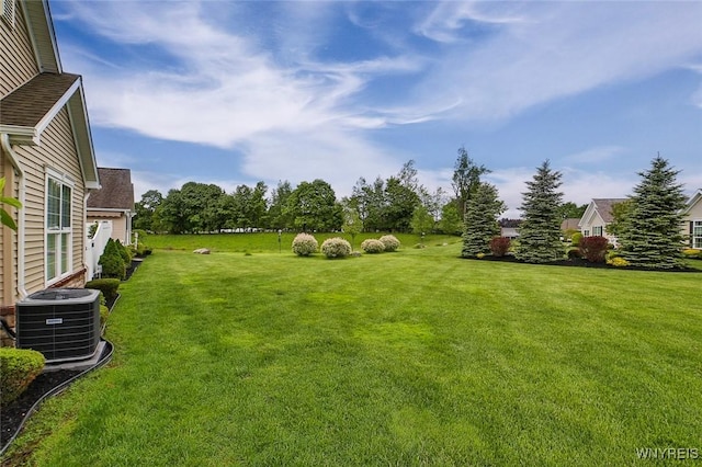 5692 Ferncrest Ct Unit B, Clarence, NY 14032 - view of green lawn featuring central AC
