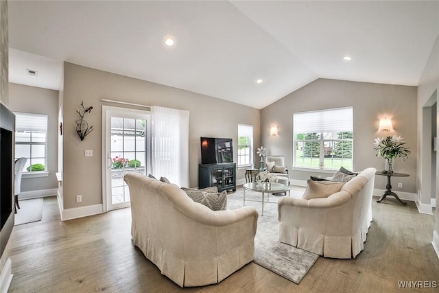 5692 Ferncrest Ct Unit B, Clarence, NY 14032 - living room featuring lofted ceiling, baseboards, light wood-type flooring, and recessed lighting