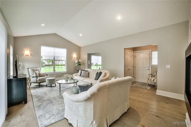 5692 Ferncrest Ct Unit B, Clarence, NY 14032 - living room with vaulted ceiling, light wood finished floors, baseboards, and recessed lighting