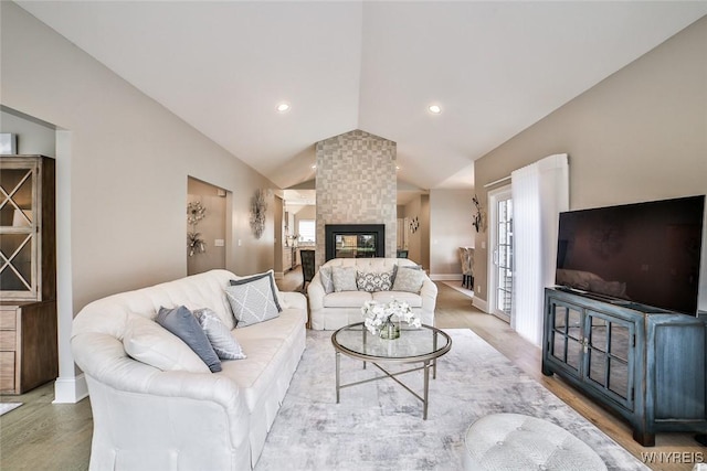 5692 Ferncrest Ct Unit B, Clarence, NY 14032 - living room featuring vaulted ceiling, wood finished floors, baseboards, recessed lighting, and a multi sided fireplace