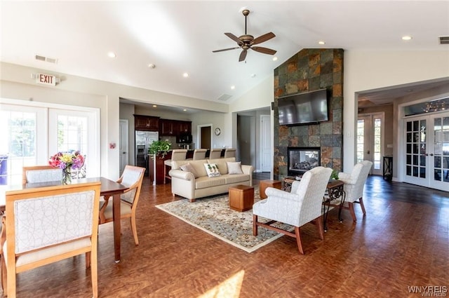 5692 Ferncrest Ct Unit B, Clarence, NY 14032 - living room featuring french doors, healthy amount of natural light, a fireplace, high vaulted ceiling, and recessed lighting