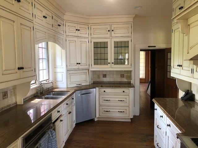 700 Rock Beach Rd, Irondequoit, NY 14617 - kitchen with dishwasher, a sink, dark wood-type flooring, dark countertops, and glass insert cabinets