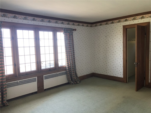 700 Rock Beach Rd, Irondequoit, NY 14617 - unfurnished room with light carpet, baseboards, wallpapered walls, and radiator